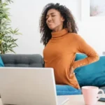 how to sit in a chair with lower back pain